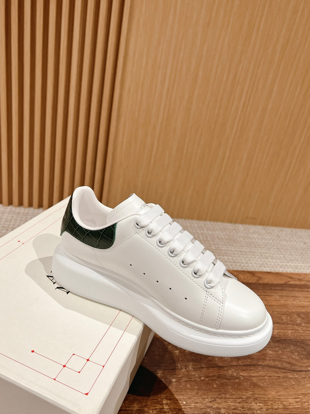 Alexander McQueen leather sneakers, white with green collar and lace-up design