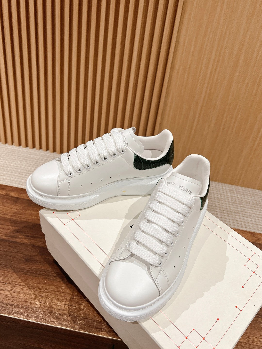 Alexander McQueen leather sneakers, white with green collar and stitched lace-up rows