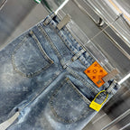 Louis Vuitton denim pants with monogram pattern, curved front pockets, belt loops