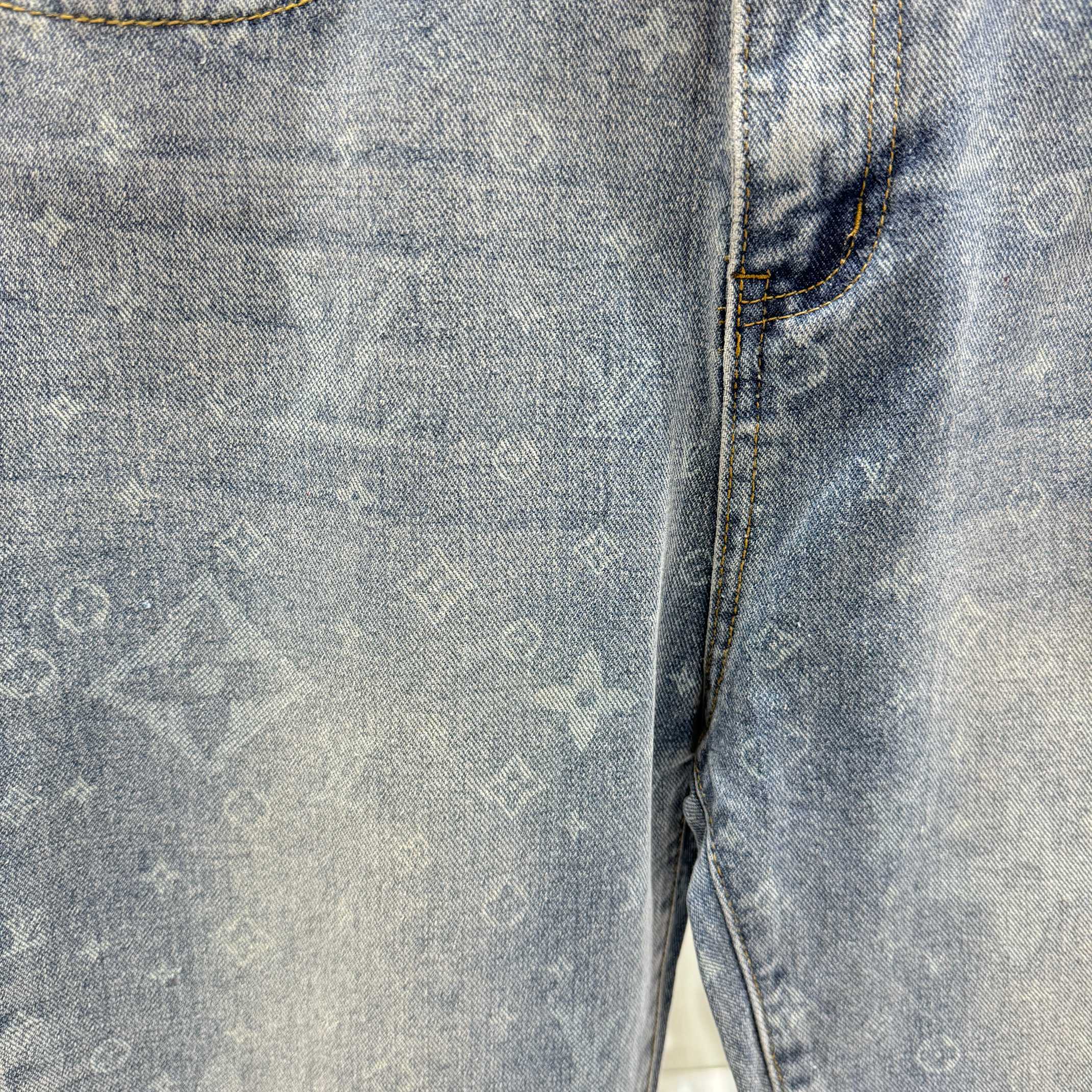 Louis Vuitton denim fabric close-up, light blue monogram print, stitched seam