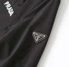 Black PRADA long jacket with triangular logo badge