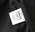 Black PRADA long jacket care label inside hood lining