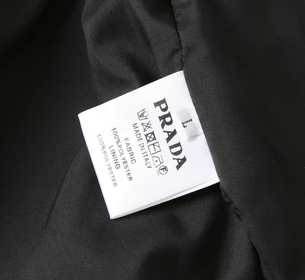 Black PRADA long jacket care label inside hood lining