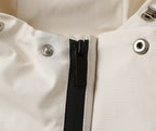 Prada long jacket close-up of black center placket with silver snaps
