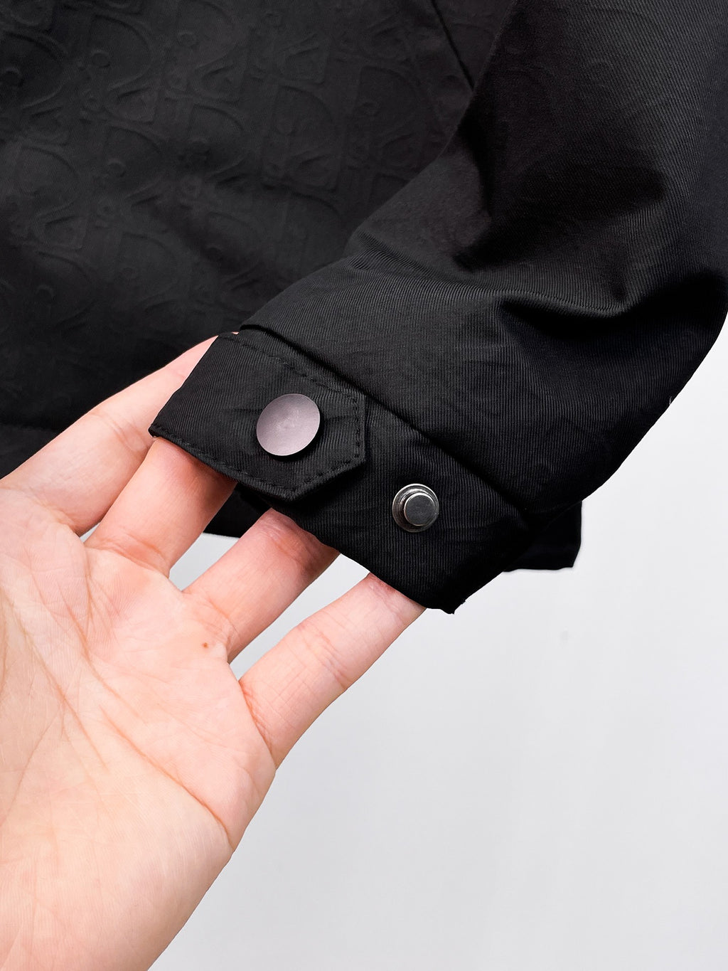 Dior long jacket, black cuff with snap button and textured sleeve end
