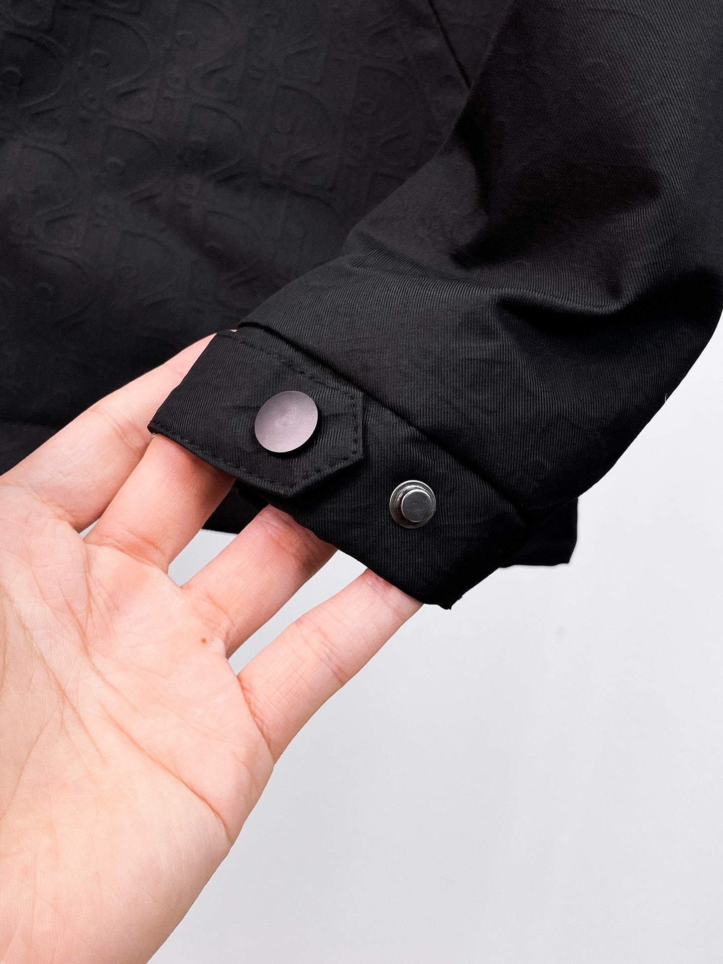Dior long jacket, black cuff with snap button and textured sleeve end
