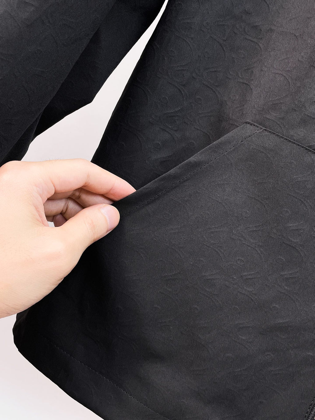 Dior long jacket, black textured fabric sleeve with visible seam stitching