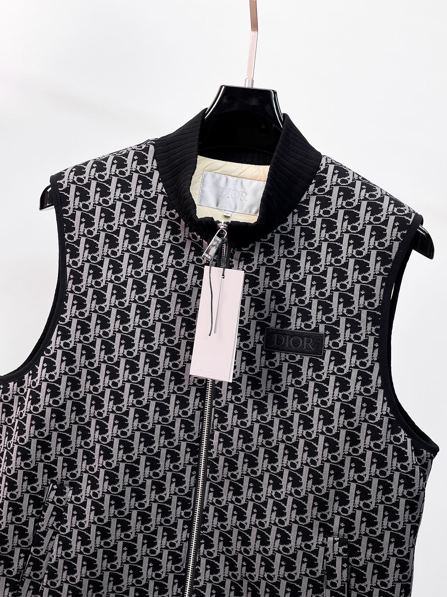 Black sleeveless vest with Dior monogram pattern, zip front and stand collar