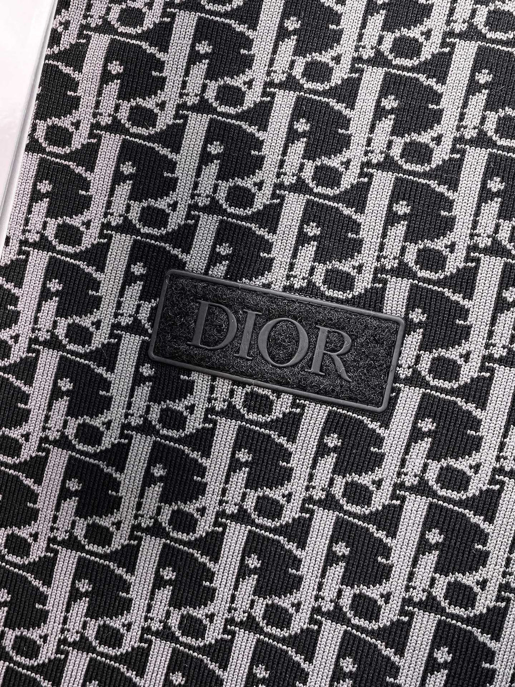 Black fabric patch label with Dior logo on monogram patterned vest