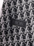 Black fabric patch label with Dior logo on monogram patterned vest