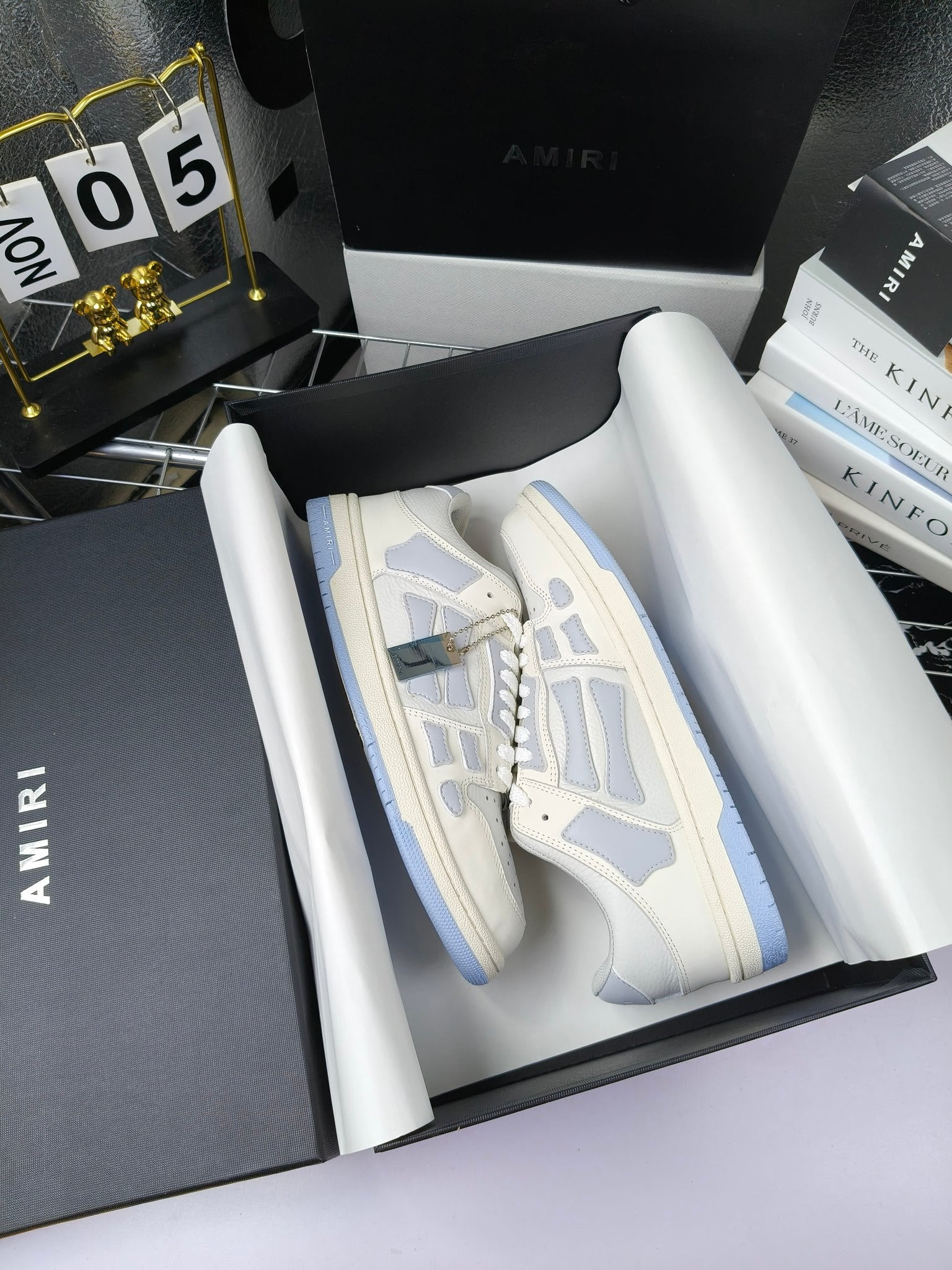 Amiri lace-up sneakers in box, white leather with blue stripe trim