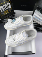 Amiri lace-up sneakers pair, white leather with light-blue panels and perforated toe