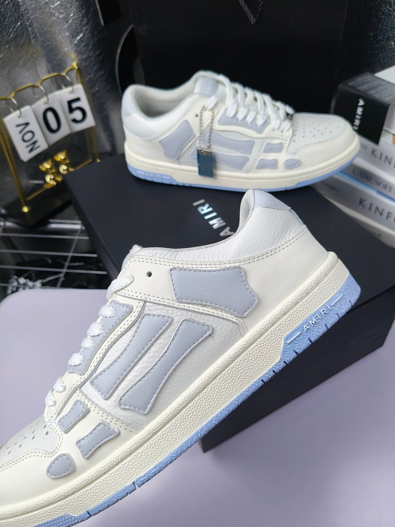 Amiri lace-up sneakers, white leather with blue logo stripes and lace-up closure