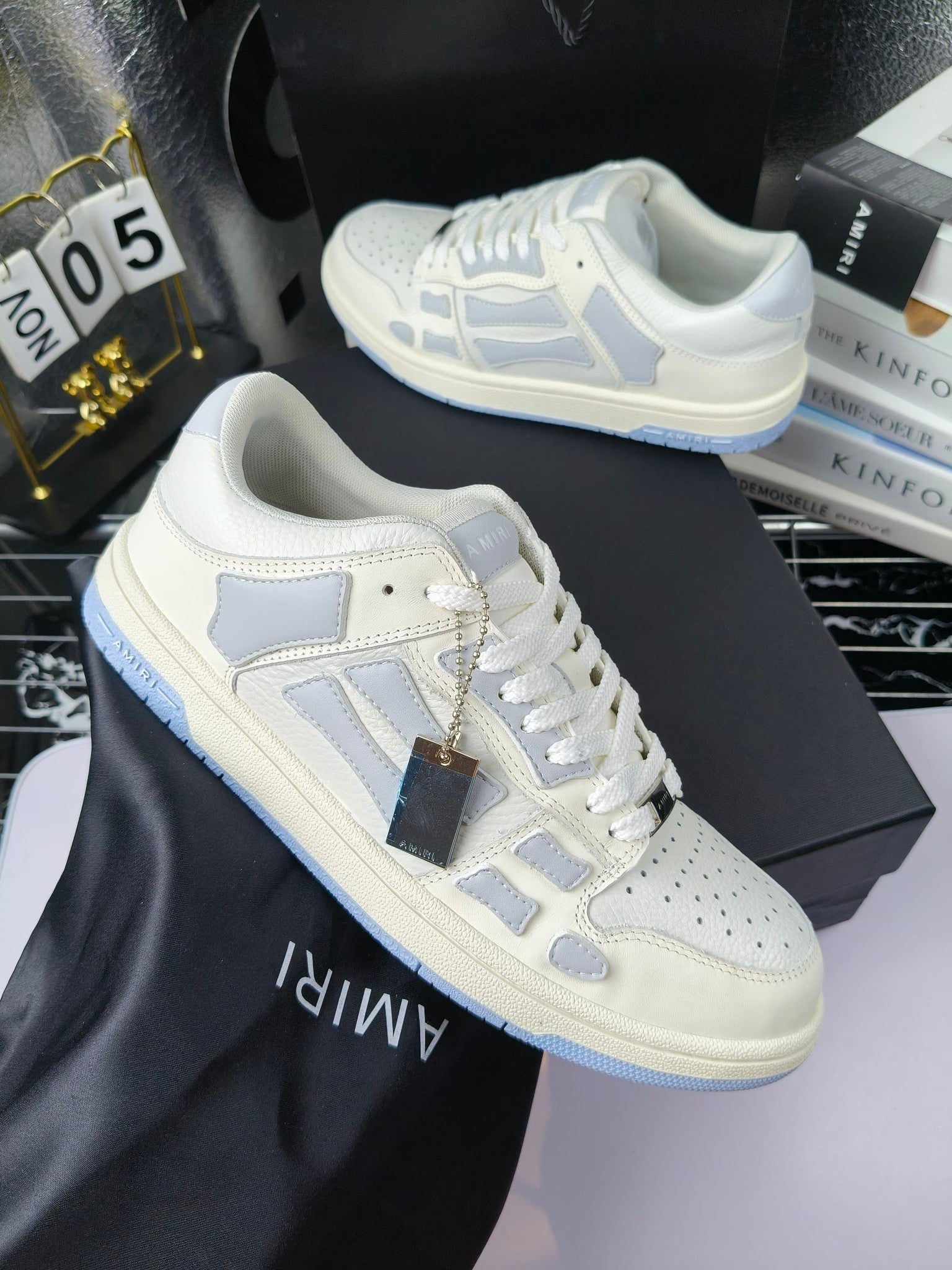 Amiri lace-up sneakers, white leather with blue side panels and gold tag