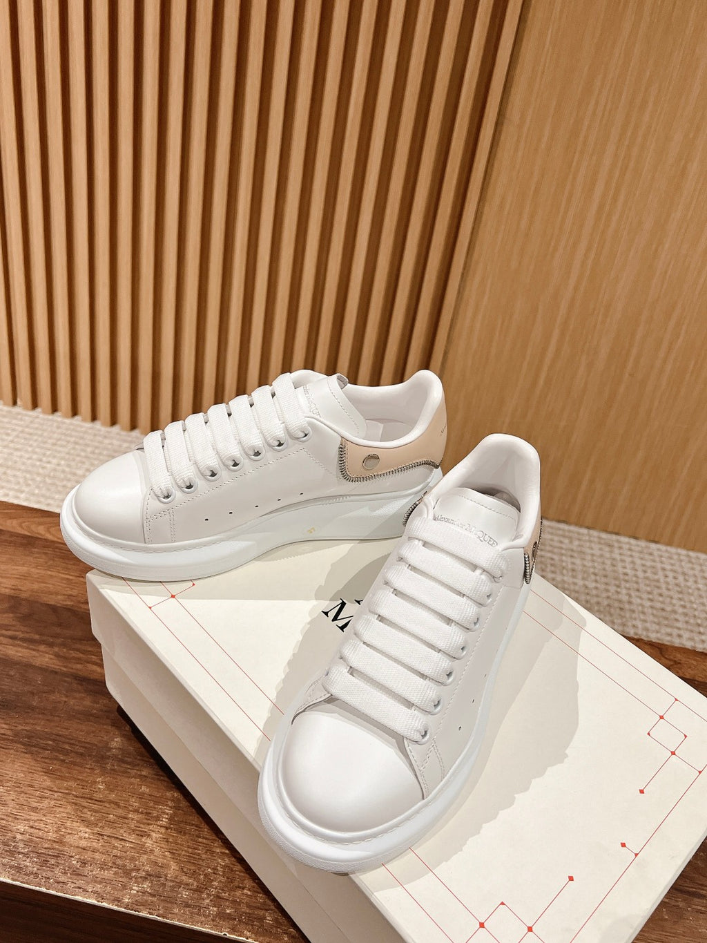 White leather sneakers with lace-up closure and beige heel tab, Alexander McQueen