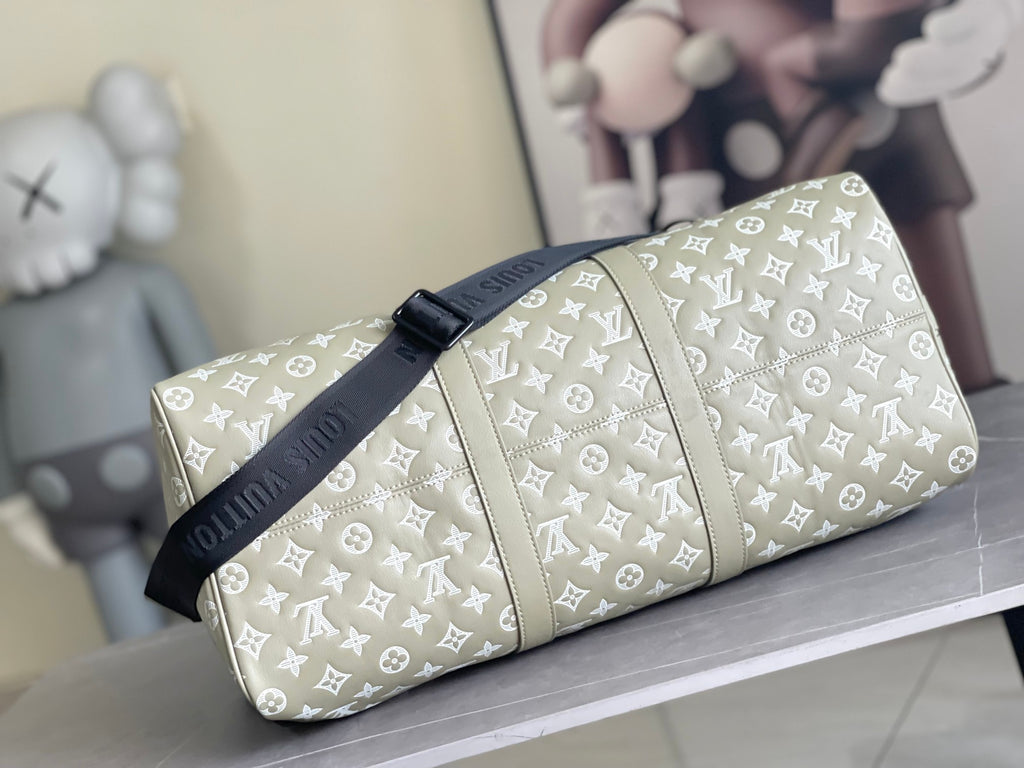Men's Louis Vuitton monogram duffel bag with zipper and strap detail, light beige
