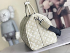 Louis Vuitton duffel bag, light beige monogram canvas, curved handles and shoulder strap
