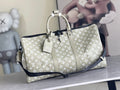 Men's Louis Vuitton monogram duffel bag in light beige with top handles and zipper
