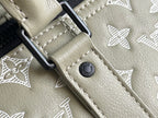 Louis Vuitton monogram bag leather tab with metal clasp and strap ring, beige
