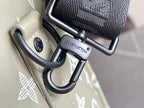 Louis Vuitton duffel bag handle straps with black metal rings and embossed logo tag