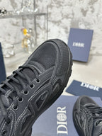 Charcoal gray lace-up sneaker side view with contrast stitching and textured upper