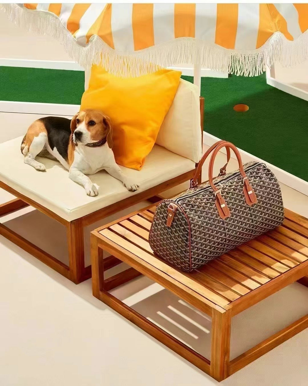 Brown patterned top-handle tote bag with leather handles and zipper top