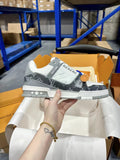 White and dark monogram low-top Louis Vuitton trainer shoes, lace-up, rubber sole.