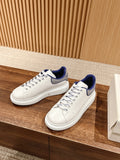Alexander McQueen low-top sneakers in white with blue collar and lace eyelets