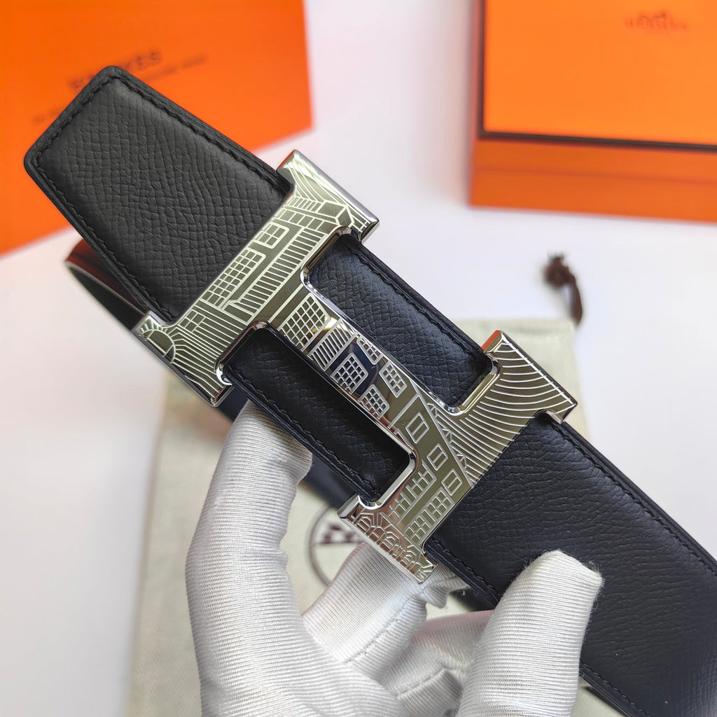 Hermes belt angled view: black leather with silver-tone buckle and stitched edge