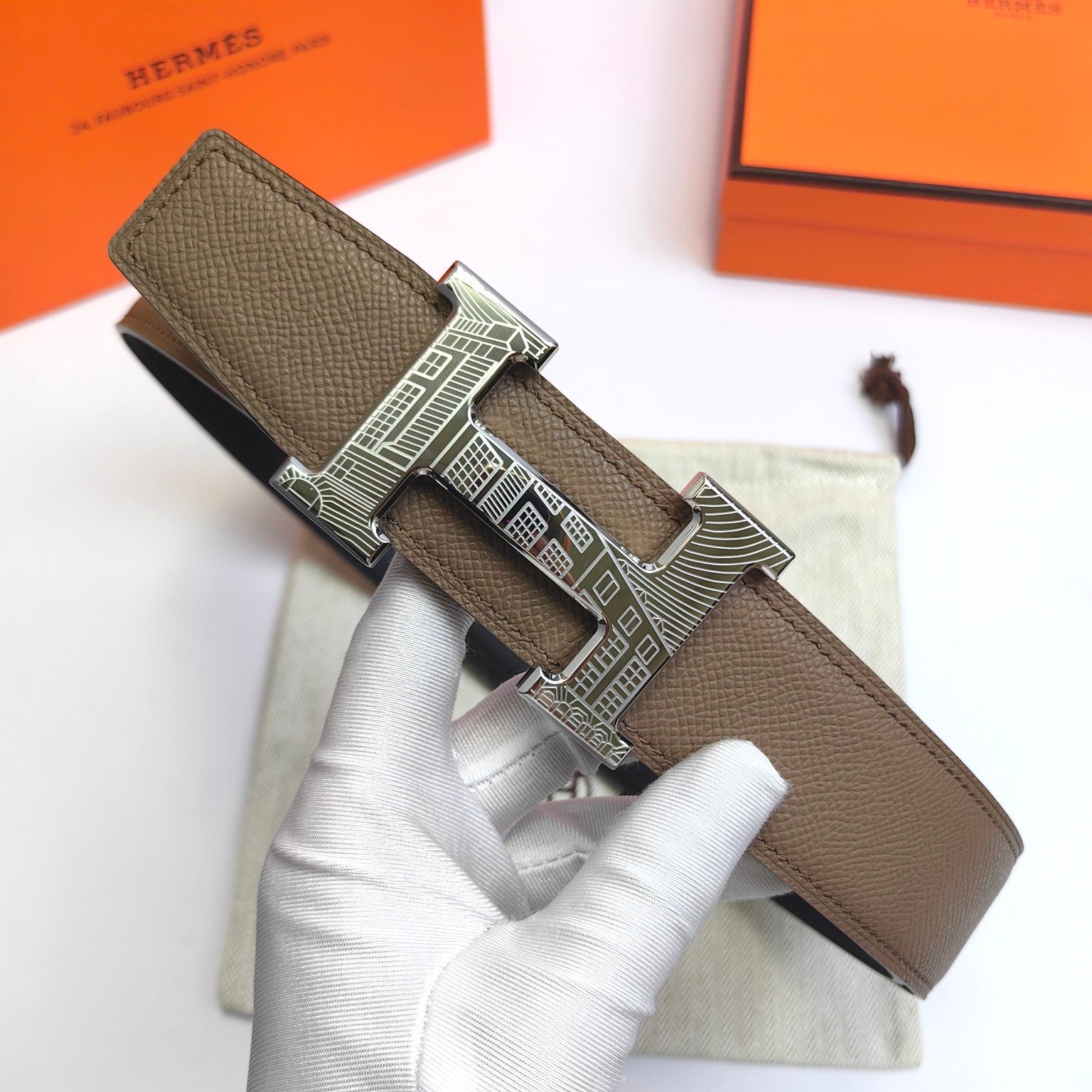 Olive leather belt with silver-tone geometric buckle and strap keeper