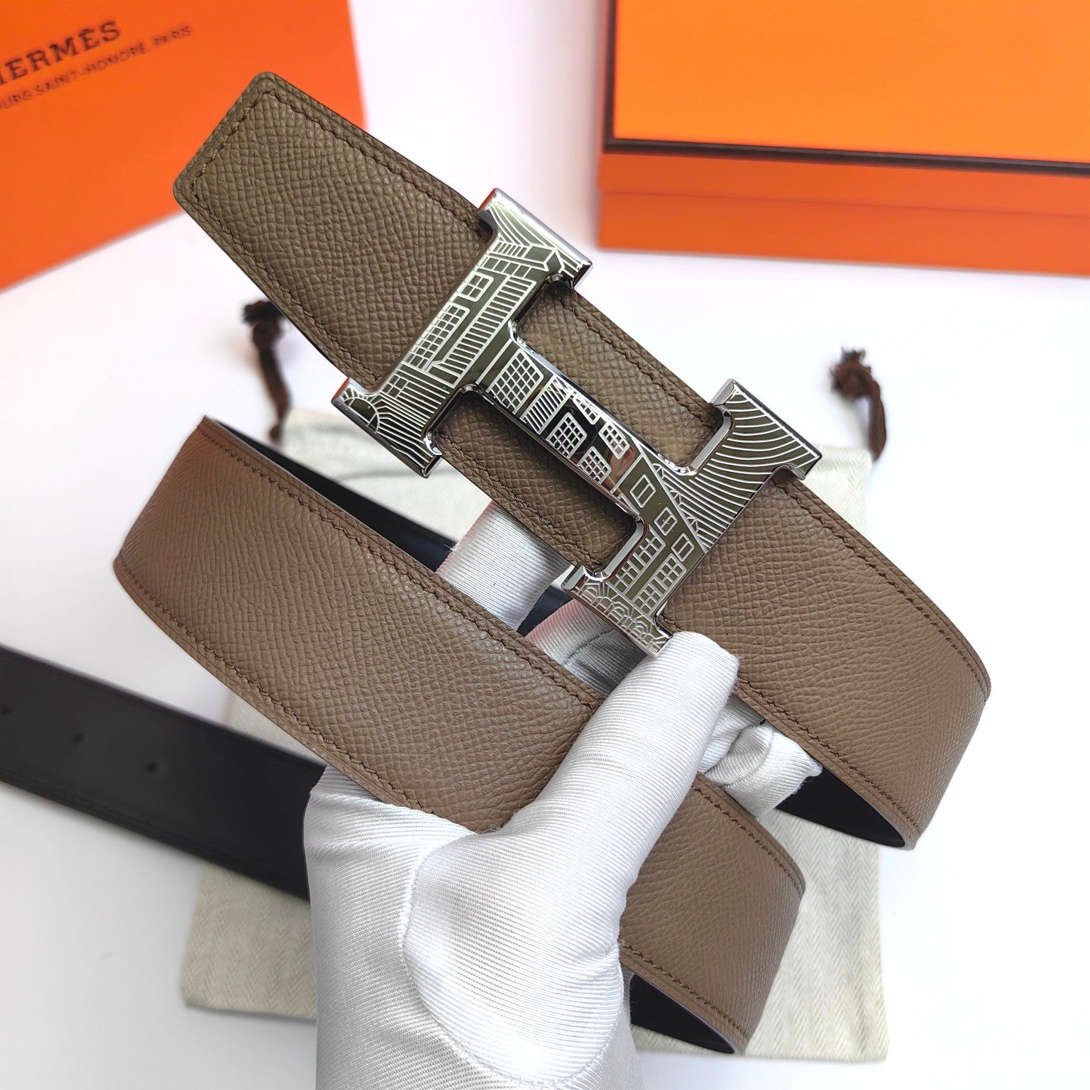 Olive leather belt with silver-tone geometric buckle and stitched strap end