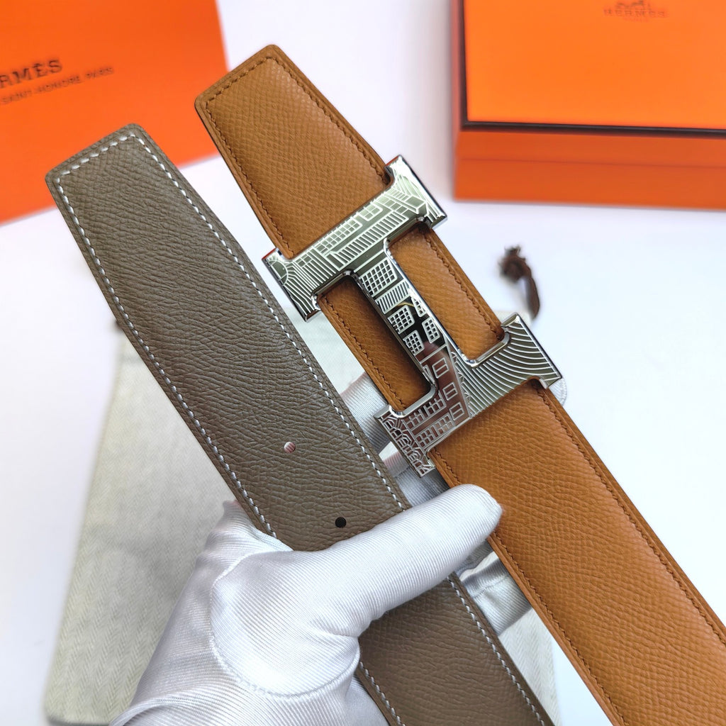 Leather belt with tan strap and gray underside, silver-tone buckle