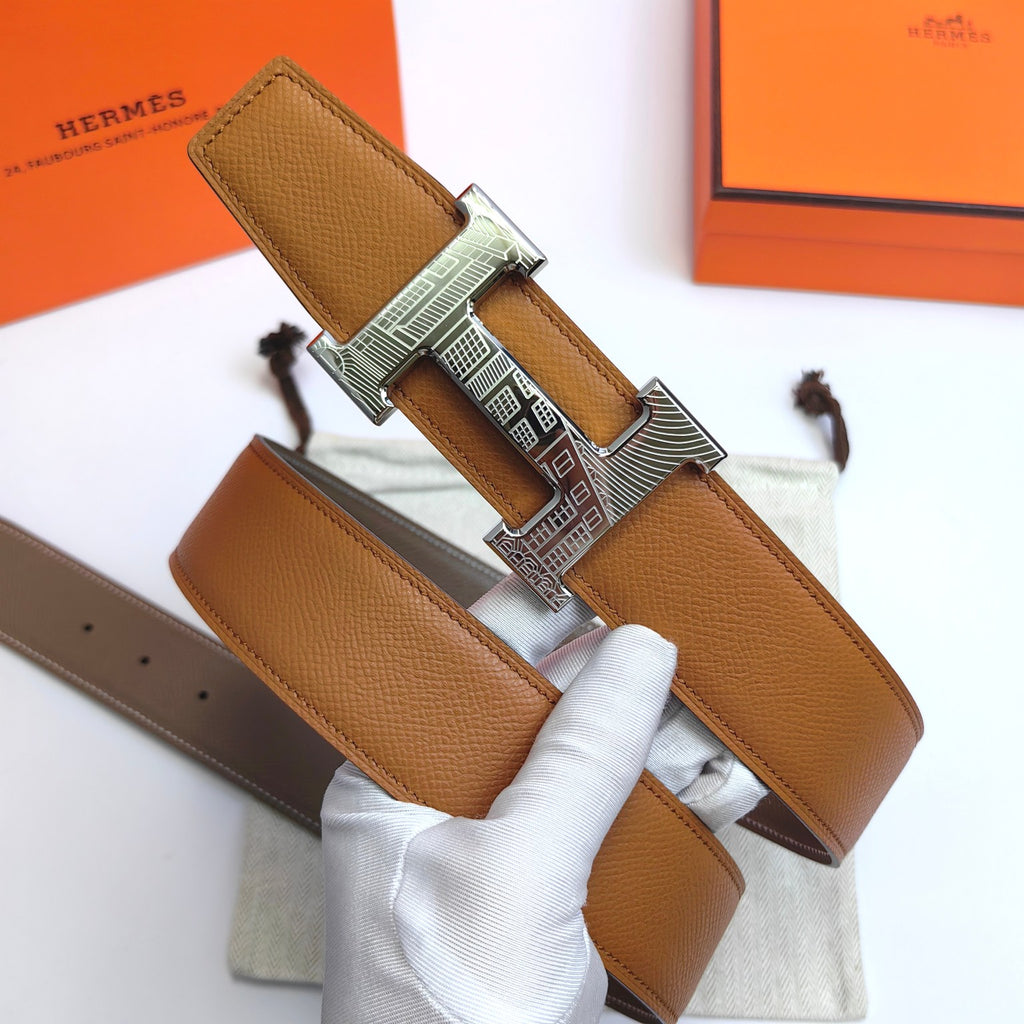 Leather belt with tan textured strap and silver-tone geometric buckle