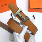 Leather belt with tan textured strap and silver-tone geometric buckle