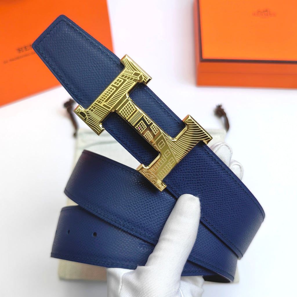 Hermes leather belt with blue strap and gold H buckle, shown front end