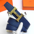 Hermes leather belt with blue strap and gold H buckle, shown front end