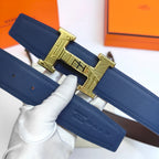 Hermes leather belt close-up: blue strap and gold H buckle