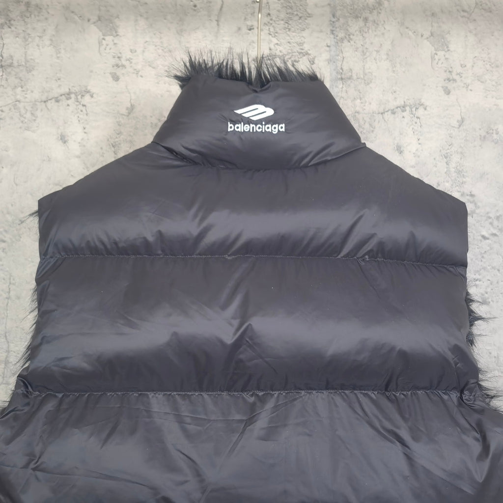 Navy puffer vest with faux-fur collar trim and balenciaga logo on back