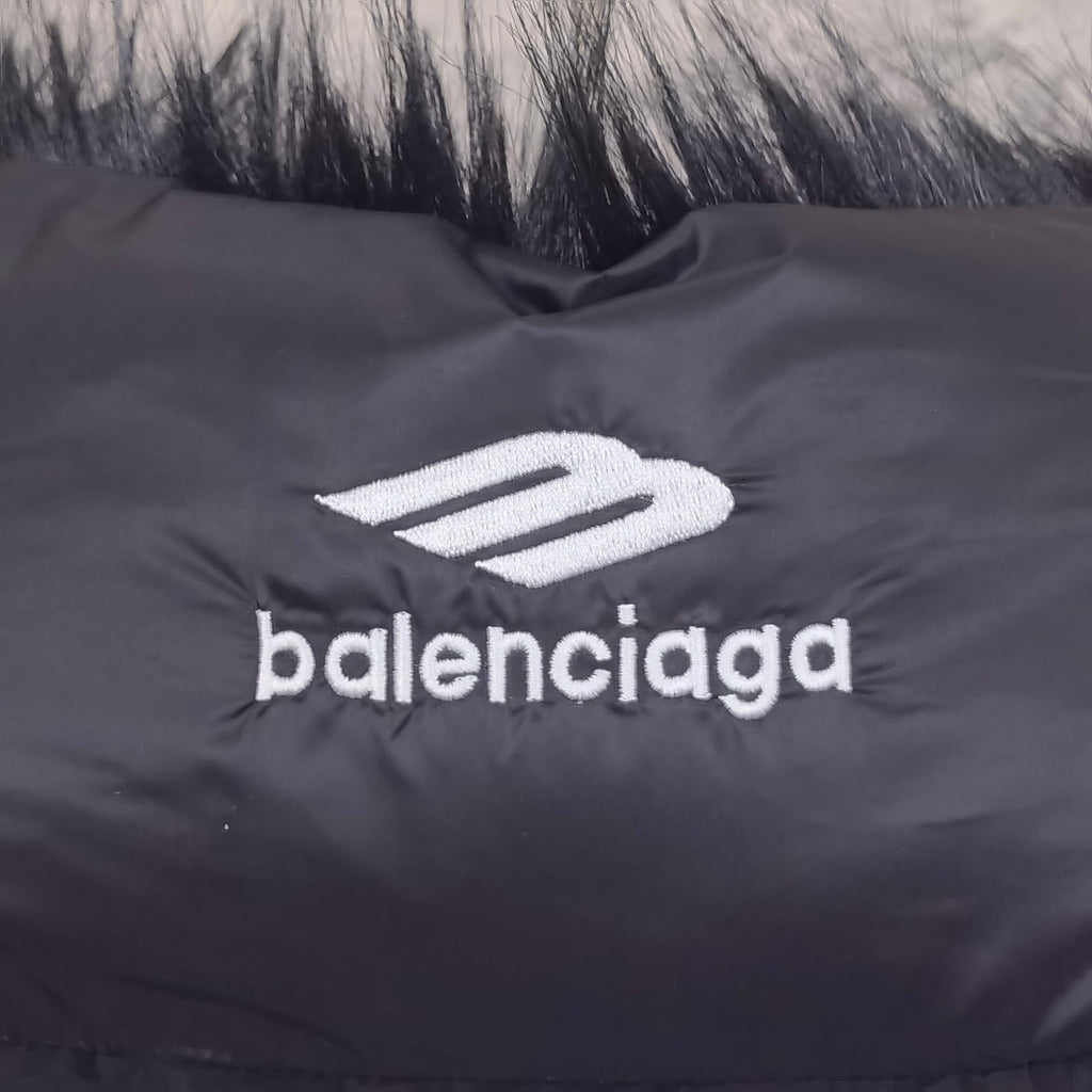 Navy puffer vest chest logo detail with balenciaga wordmark and emblem