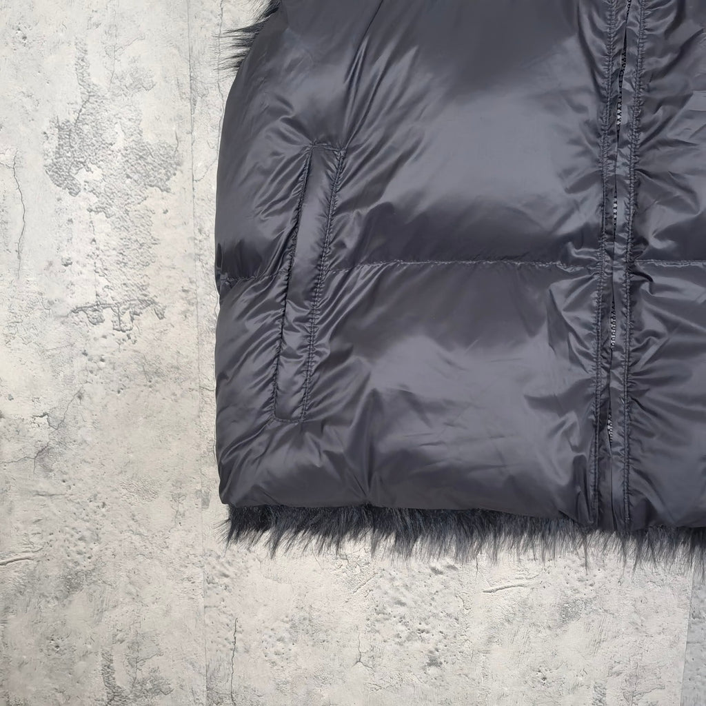 Navy puffer vest sleeve opening and faux-fur hem trim with zip-front seam