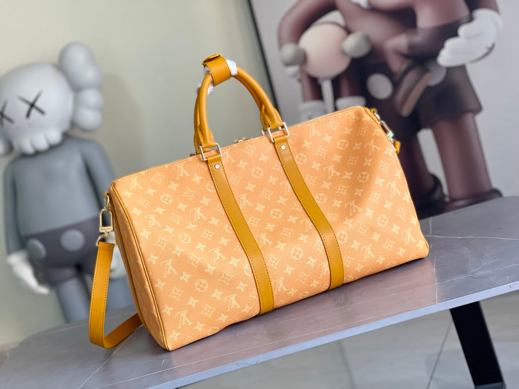 Louis Vuitton monogram duffel bag with wide yellow strap and front seams