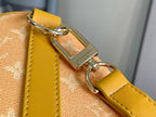 Louis Vuitton monogram bag clasp and keyring hardware with yellow leather loop
