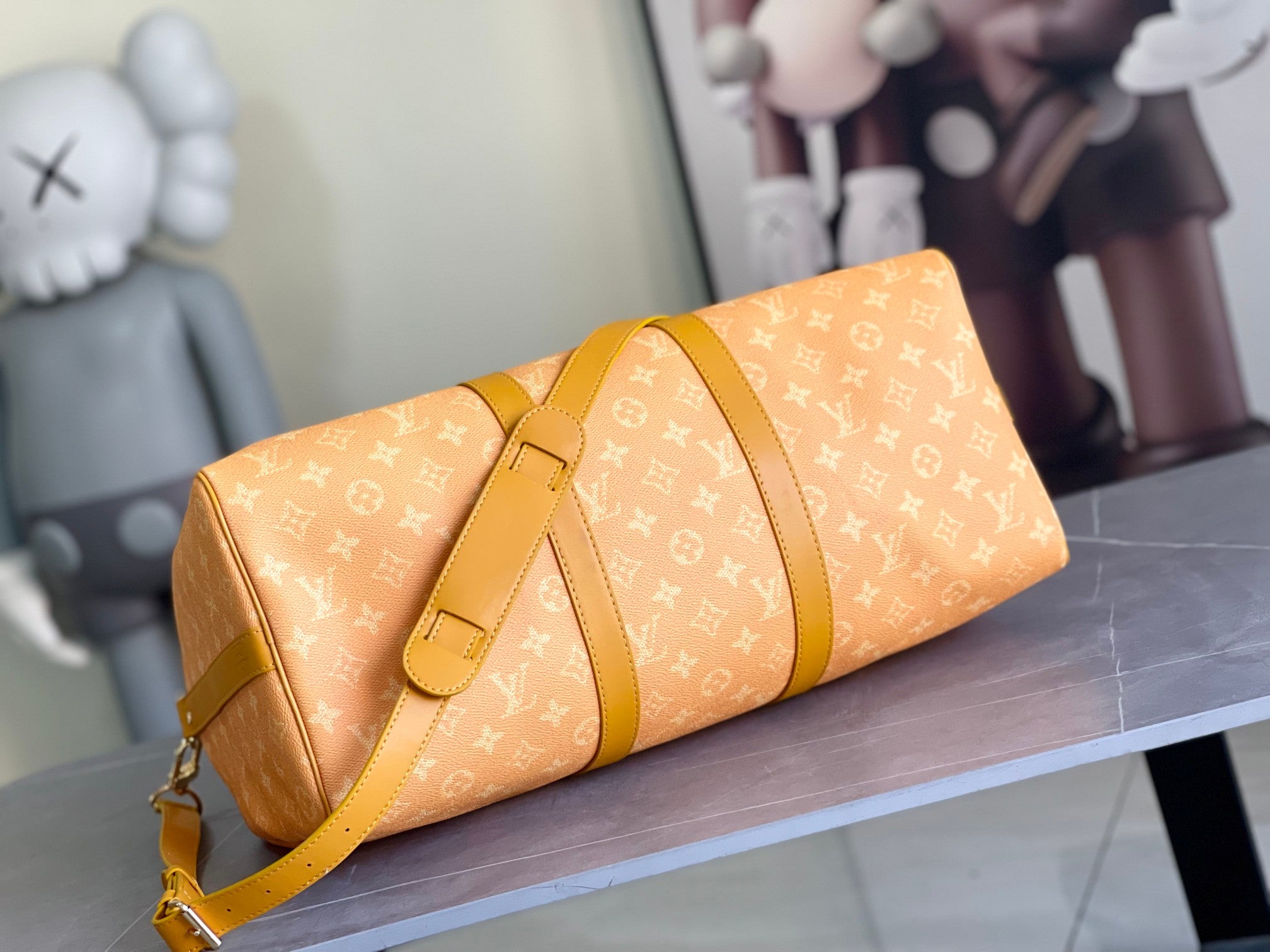 Louis Vuitton monogram duffel bag with front flap and adjustable shoulder strap
