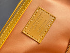 Louis Vuitton Paris leather tag with embossed text on monogram bag