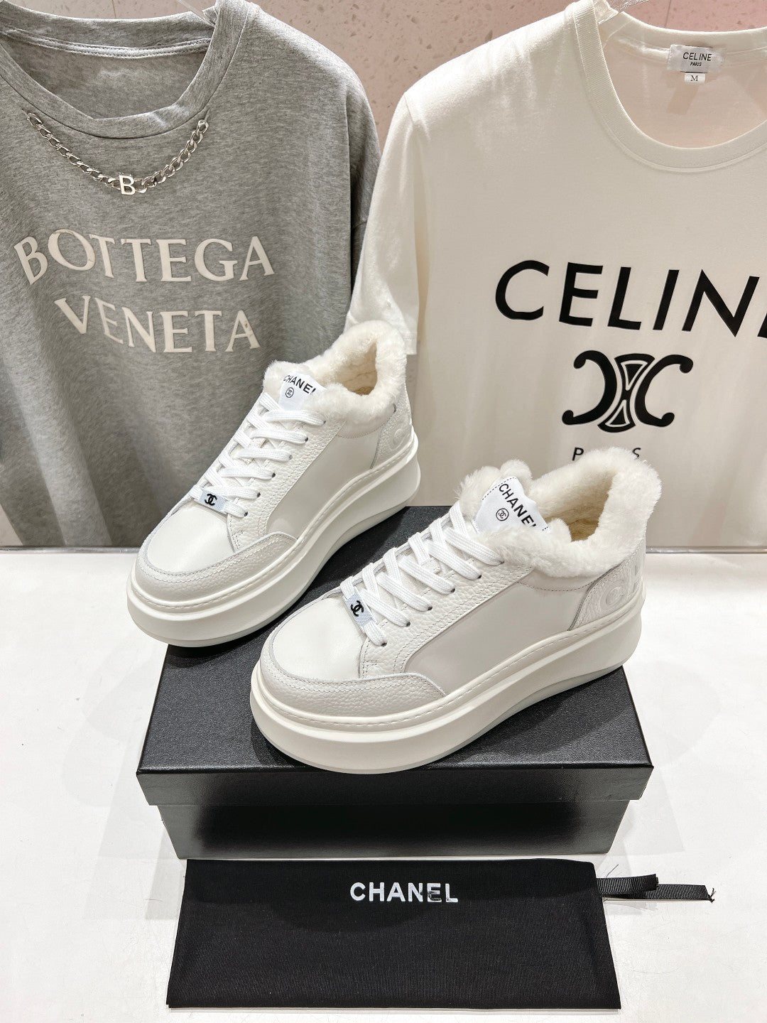 White lace-up sneakers with fluffy collar lining and Chanel logo, thick platform sole pair