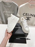 White lace-up sneakers with faux-fur collar lining, Chanel logo, chunky sole