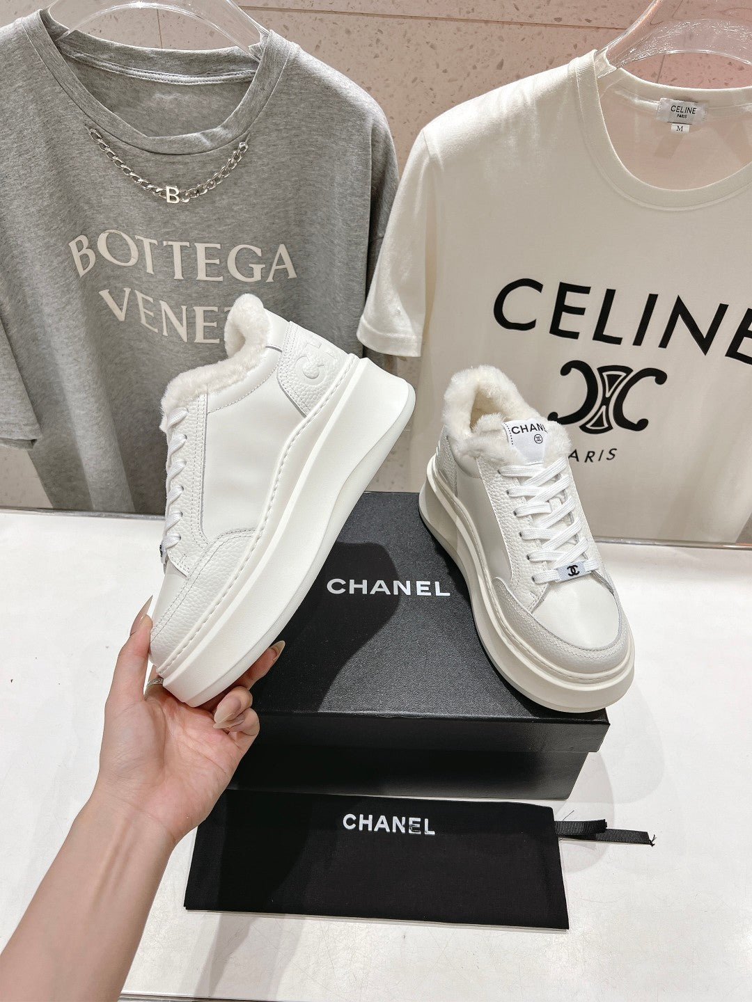 White lace-up sneakers with faux-fur collar lining, Chanel logo, chunky sole