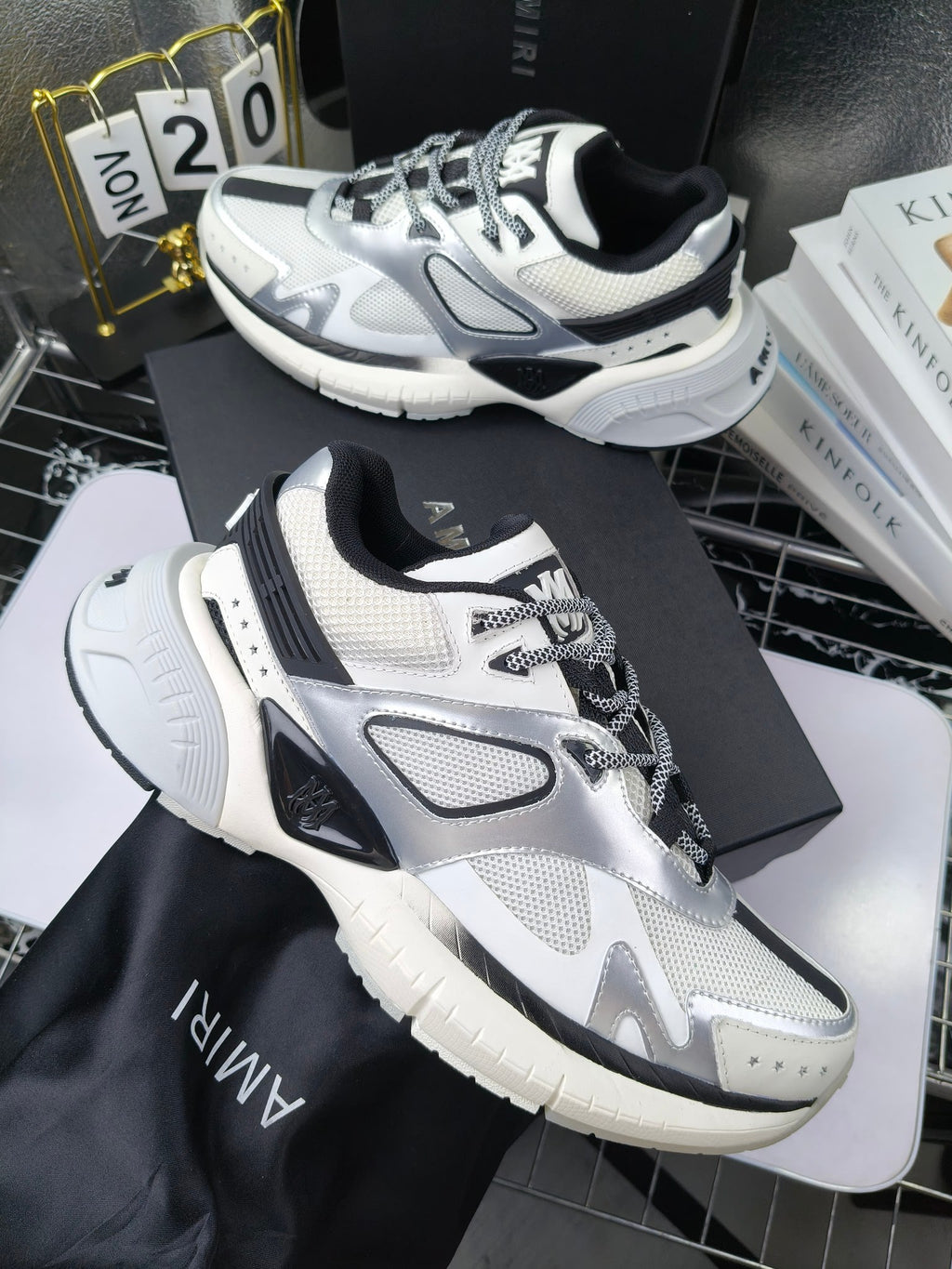 Amiri sneakers in white with black panels and lace-up top