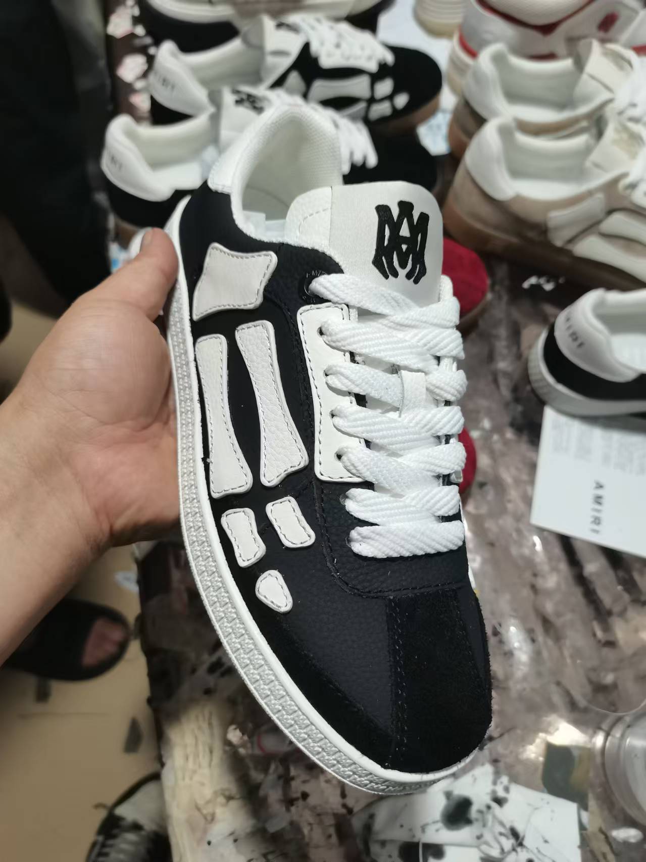 Amiri low-top sneakers, black suede with white panels and white laces