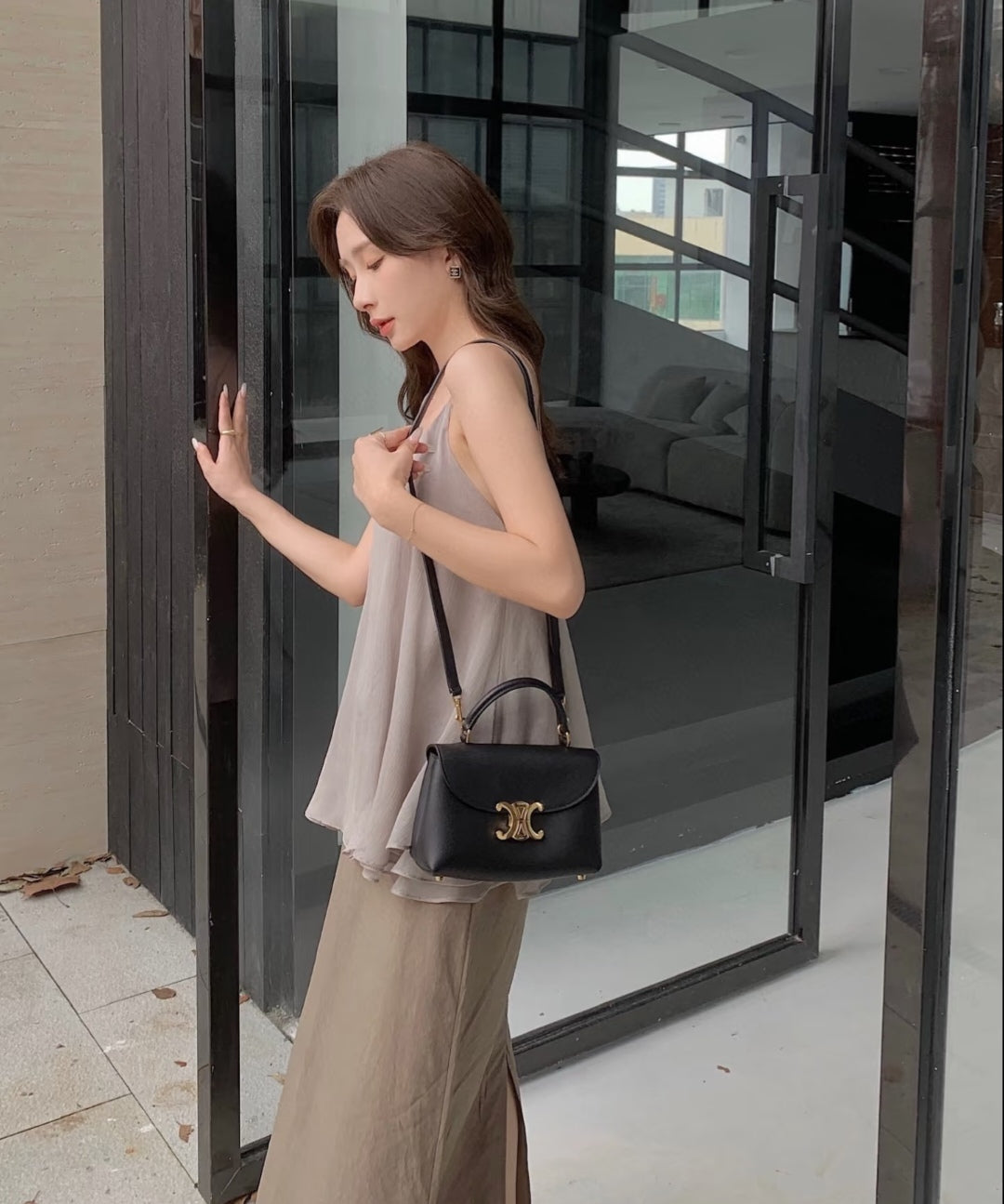 Celine black mini bag with top handles and gold logo front flap